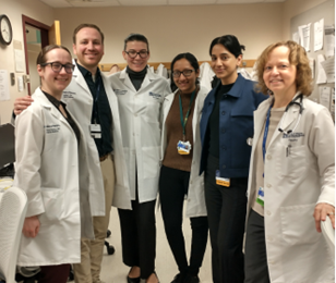 GME Internal Medicine Team standing in line for a group photo on hospital unti