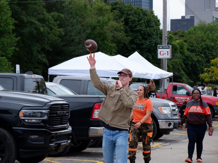 Internal Medicine resident passing a football