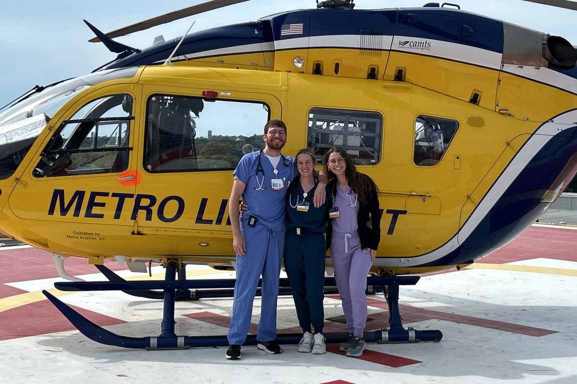 Residents next to a Metro Life Flight helicopter