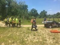 National Park Service Training Day, picture of victim on stretcher being carried to UTV
