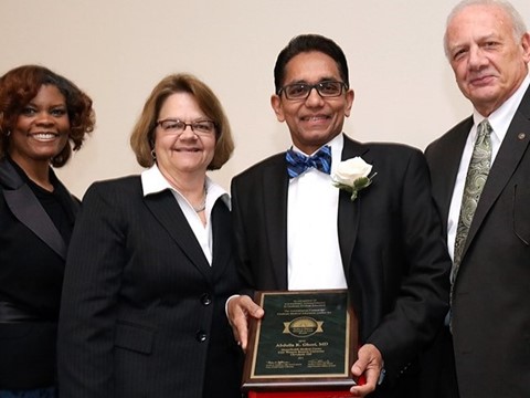 Dr. Ghori receiving award