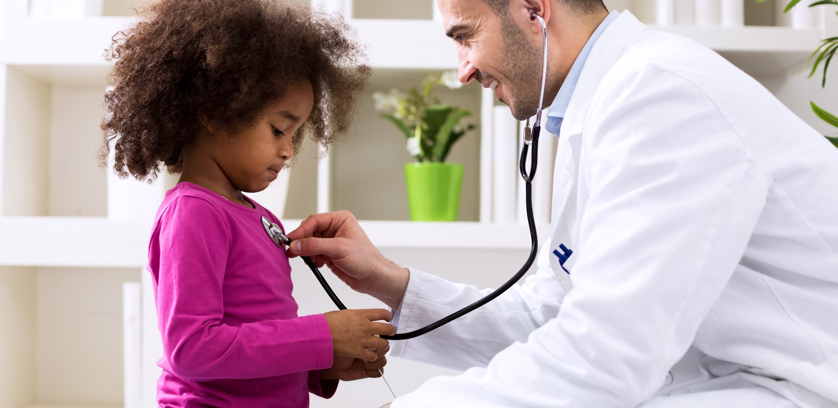 Doctor listening to pediatric patient's heart